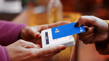 credit card making a payment on a terminal