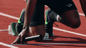 An athlete prepares to launch in a sprint race