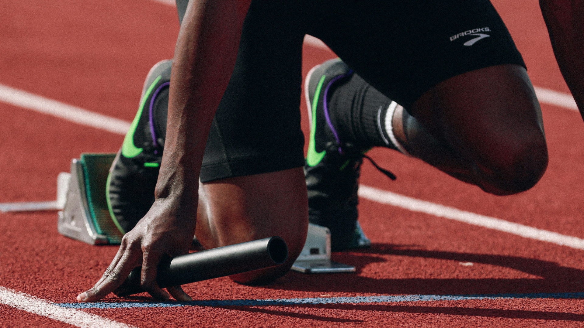 An athlete prepares to launch in a sprint race